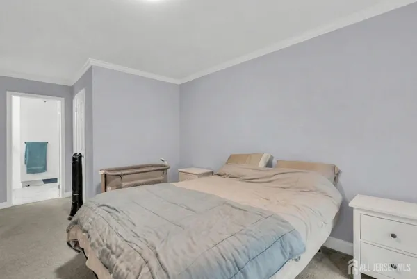 a bedroom with a bed and lamp