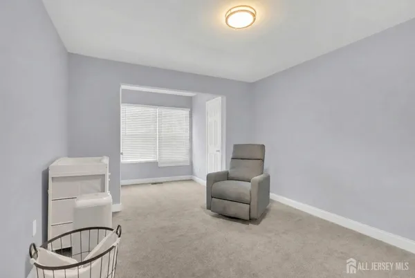 a living room with furniture a couch and a window
