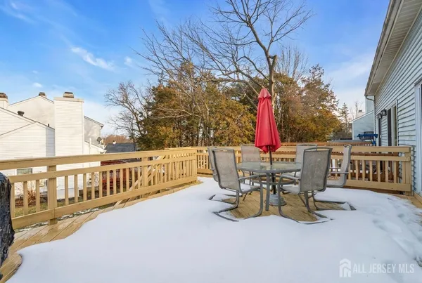 a view of a sitting area with swimming pool in the back