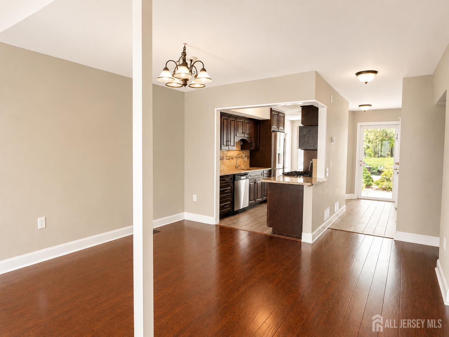 91 Delaware Lane Somerville, NJ 08876 - Photo 9 of 33 a view of a kitchen with wooden floor and a kitchen
