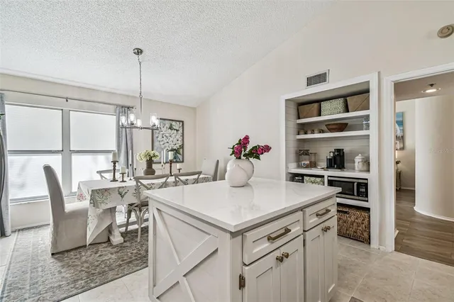 a view of a dining room and a table and chairs