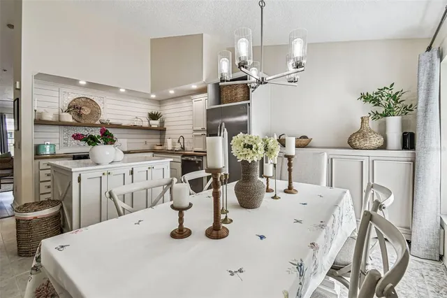 a kitchen with stainless steel appliances granite countertop a lot of counter space and cabinets