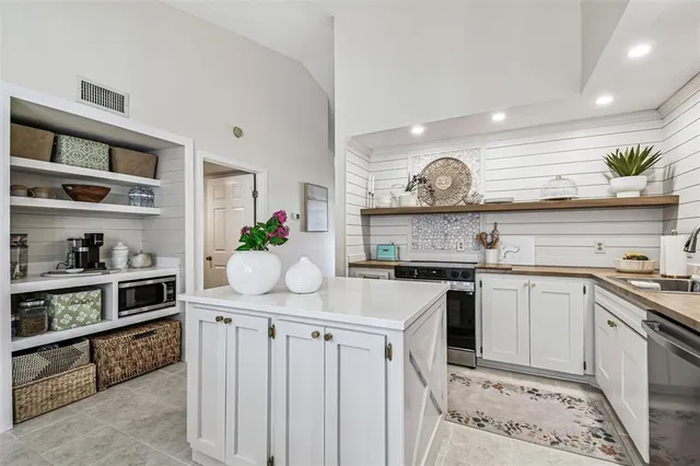 a bathroom with a sink a mirror and a shower
