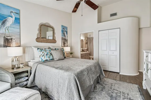 a bathroom with a double vanity sink toilet mirror and shower