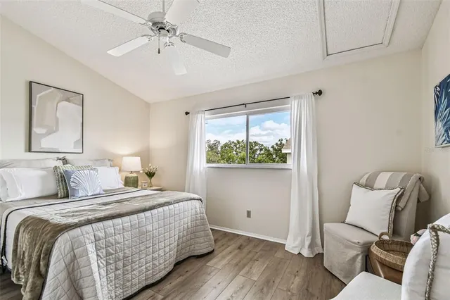 a bed room with a bed and a night stand