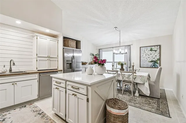 a kitchen with a sink and stove