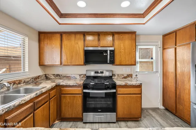 a kitchen with a stove and a sink