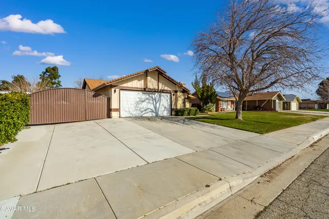 a view of garage yard and tree