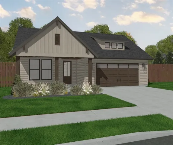 a view of a white house with garden