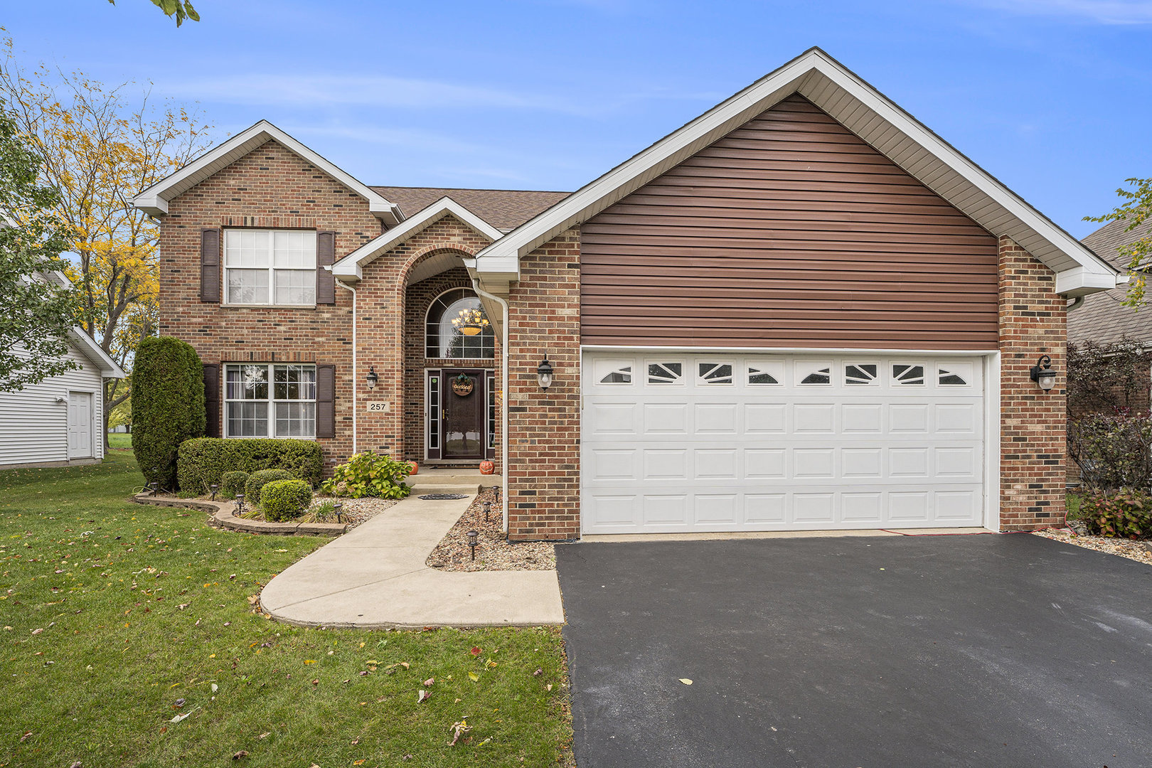 a front view of a house with garden