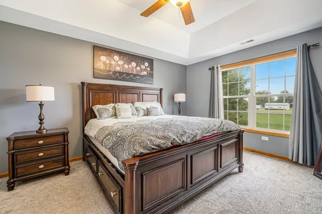 a bed room with a bed and a window