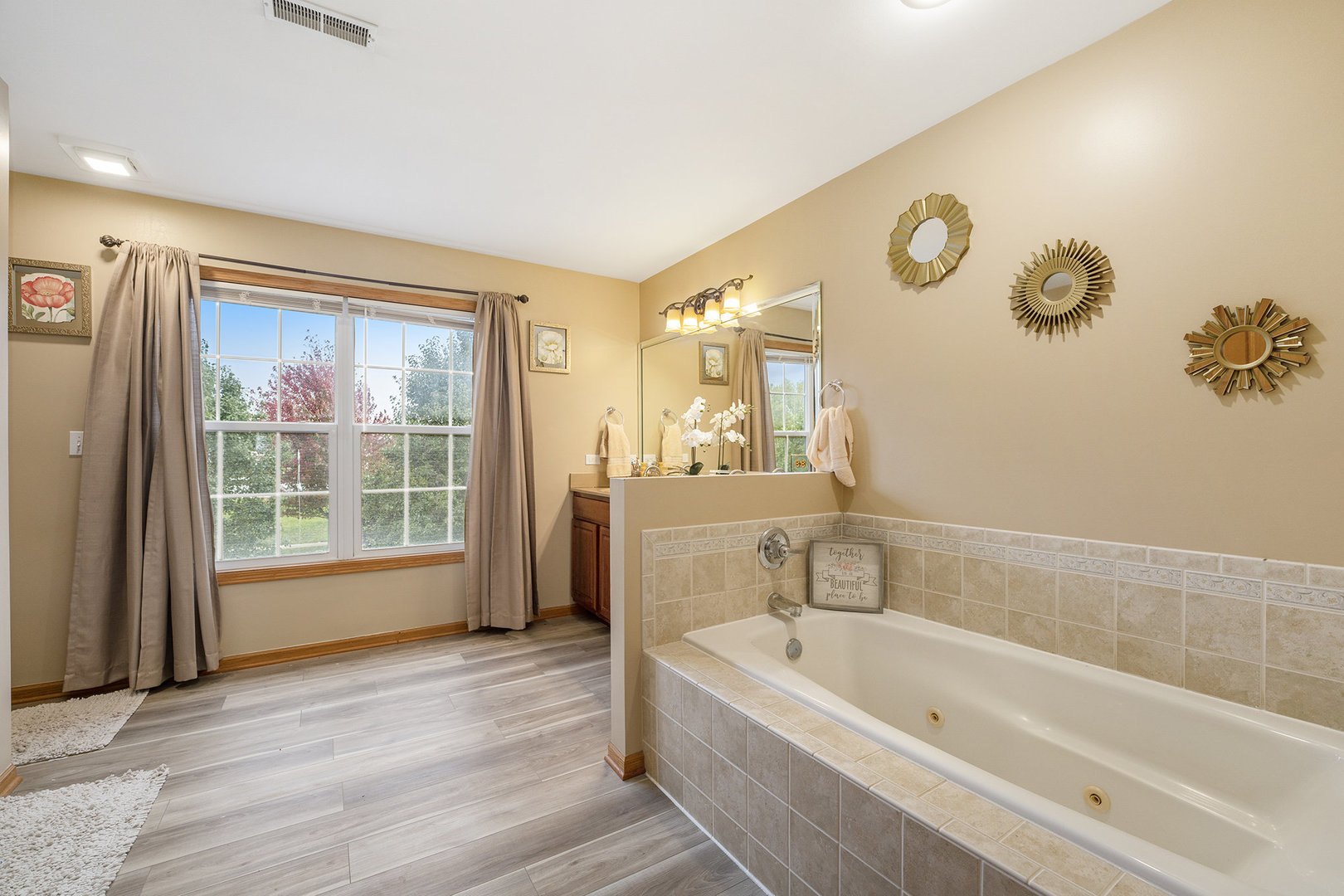 257 Pine Street Beecher, IL 60401 - Photo 14 of 31 a bathroom with a bathtub and a window