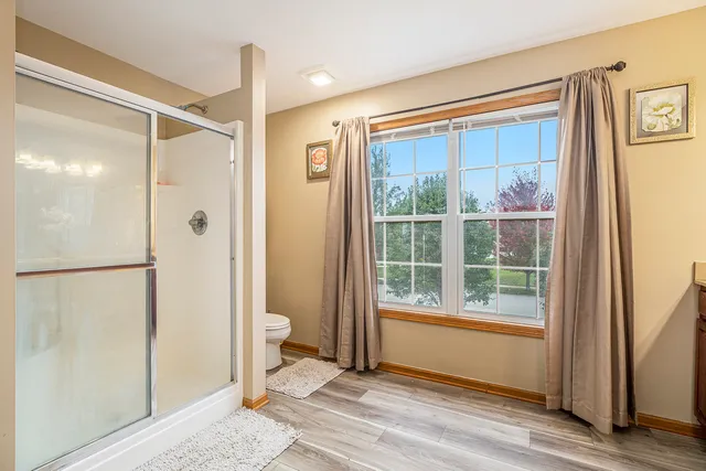 a bathroom with a glass shower door