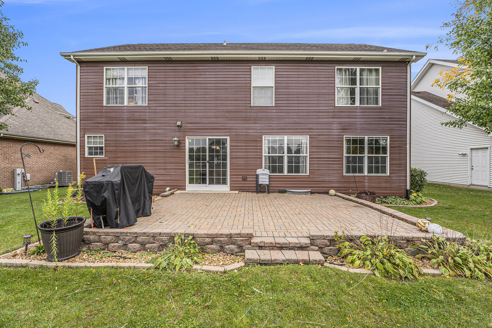 257 Pine Street Beecher, IL 60401 - Photo 30 of 31 a front view of a house with garden