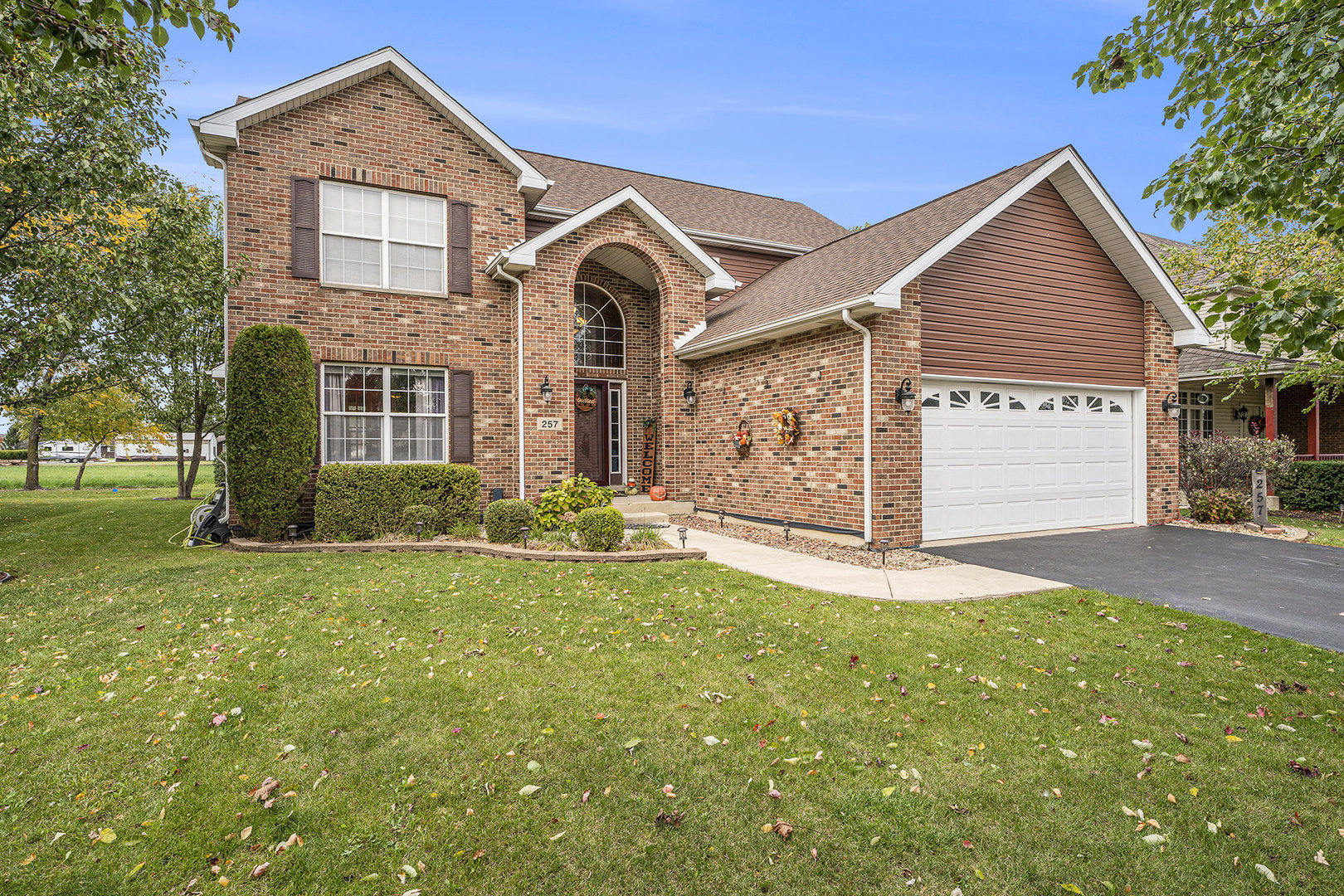 257 Pine Street Beecher, IL 60401 - Photo 31 of 31 a front view of a house with a yard and garage