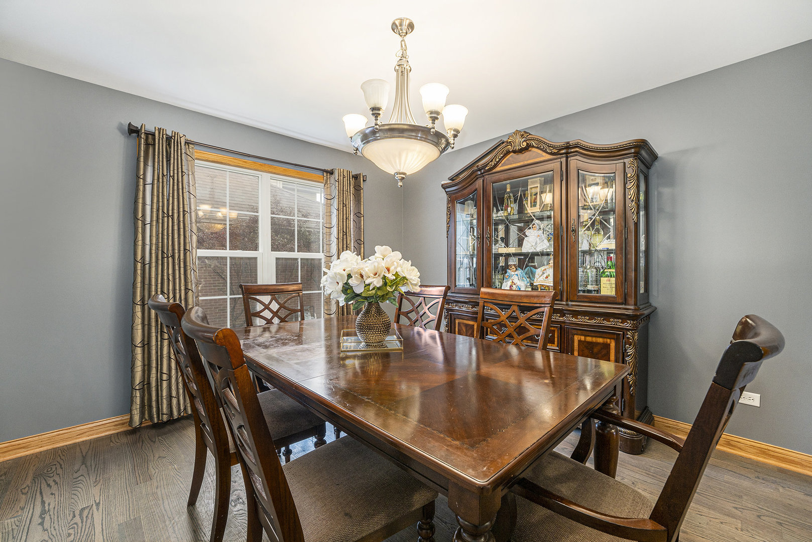 257 Pine Street Beecher, IL 60401 - Photo 8 of 31 a dining room with furniture a chandelier and wooden floor