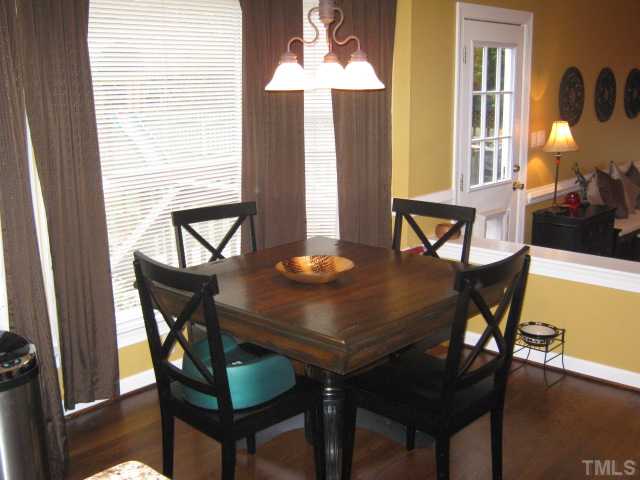 9117 Doublebit Drive Raleigh, NC 27615 - Photo 12 of 12 Breakfast area features a bay window that lets in lots of natural light and is open to the kitchen and family room area, making for a nice flowing floorplan and a great way to talk to the family while preparing a meal!