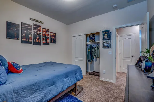 a bedroom with a bed and closet