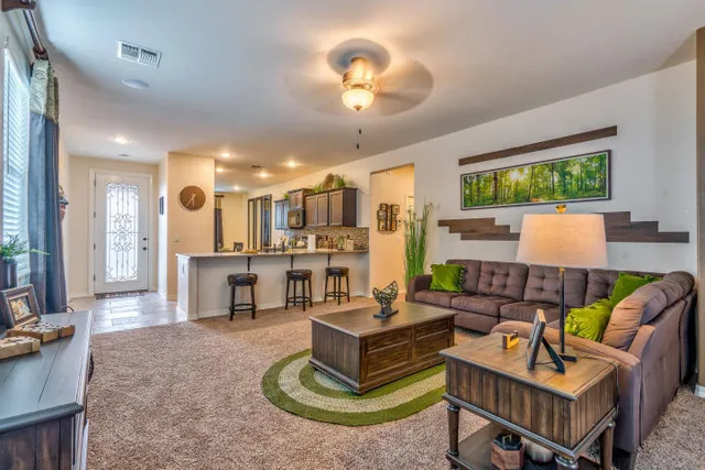a living room with furniture and a large window