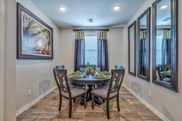a view of a dining room with furniture window and outside view