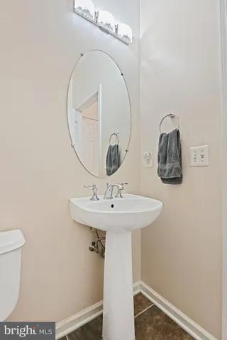 a bathroom with a sink and mirror