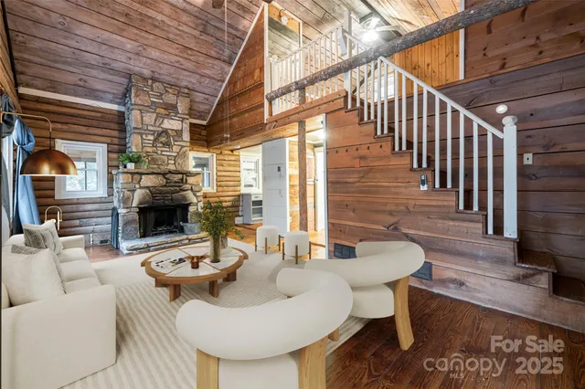 a dining room with furniture wooden floor and a rug