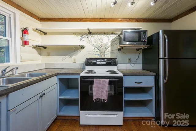 a kitchen with a stove and a refrigerator