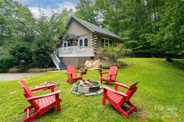 swimming pool with outdoor seating and yard