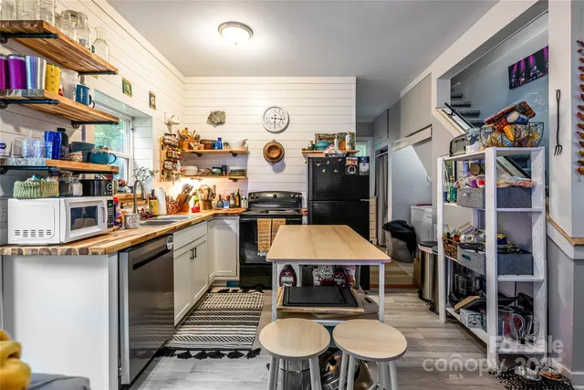 a kitchen with stainless steel appliances a stove and a refrigerator