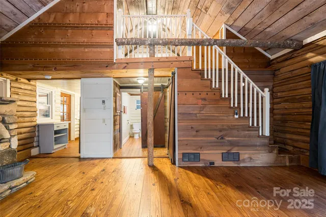 a view of an entryway with wooden floor