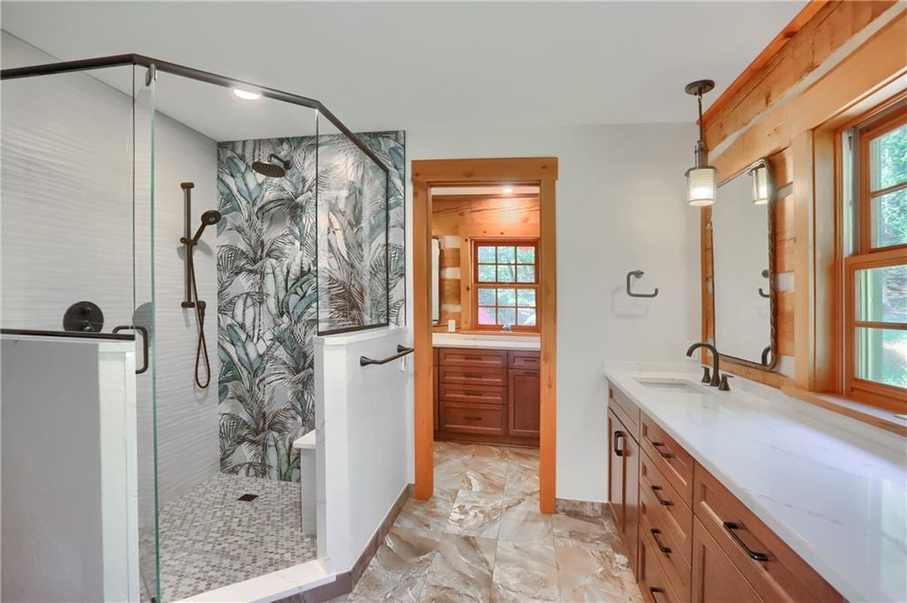 135 Mekis Road Valencia, PA 16059 - Photo 25 of 49 a bathroom with a granite countertop shower a sink and a mirror
