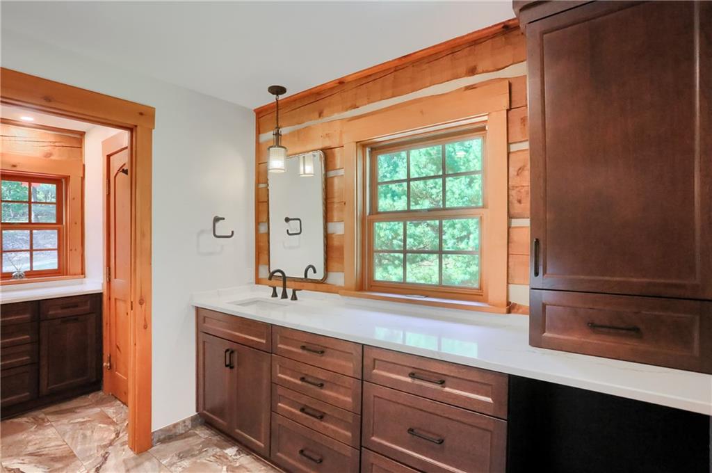 135 Mekis Road Valencia, PA 16059 - Photo 26 of 49 a bathroom with a sink mirror and a window