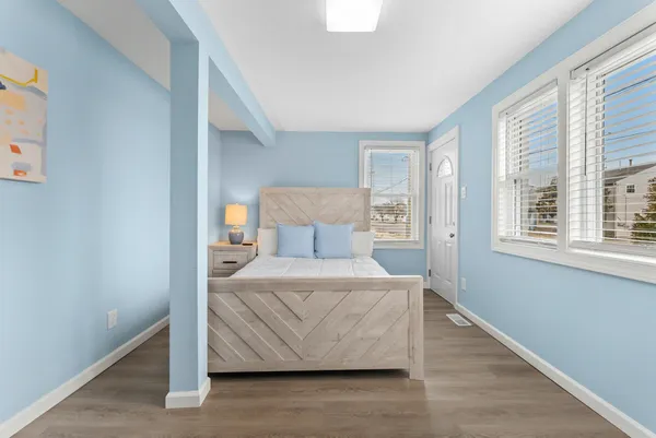 a bedroom with a bed and window