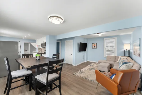 a view of a livingroom with furniture and a table