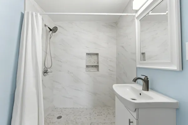 a bathroom with a shower sink