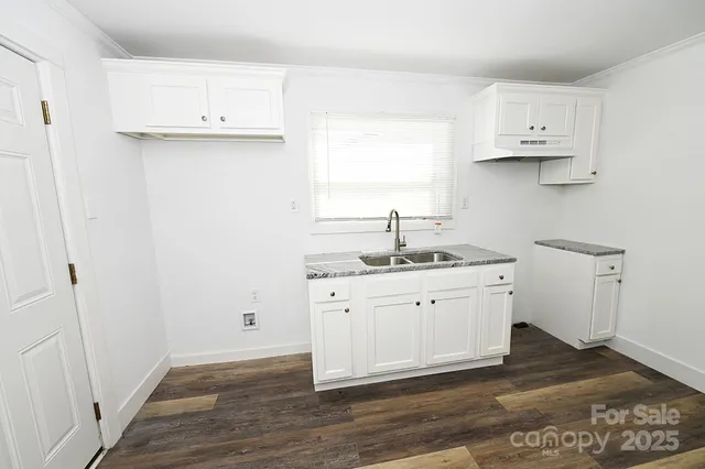a view of cabinets and wooden floor