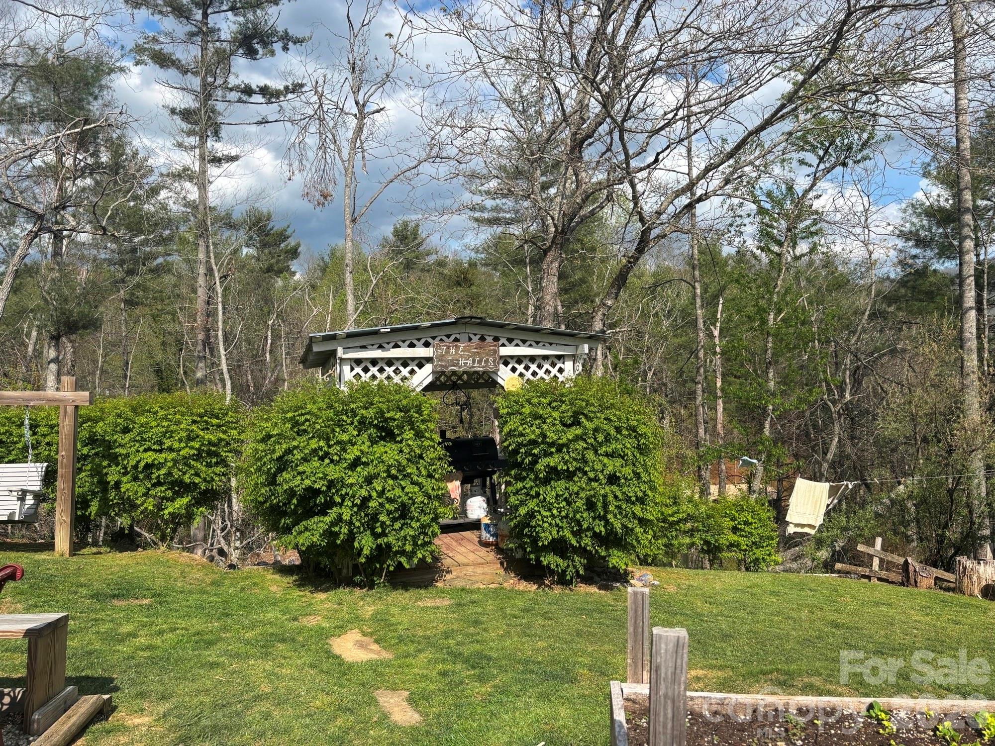 493 Franklintown Road Spruce Pine, NC 28777 - Photo 15 of 27 a view of a garden with a tree