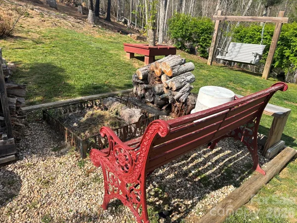 a view of a backyard with sitting area