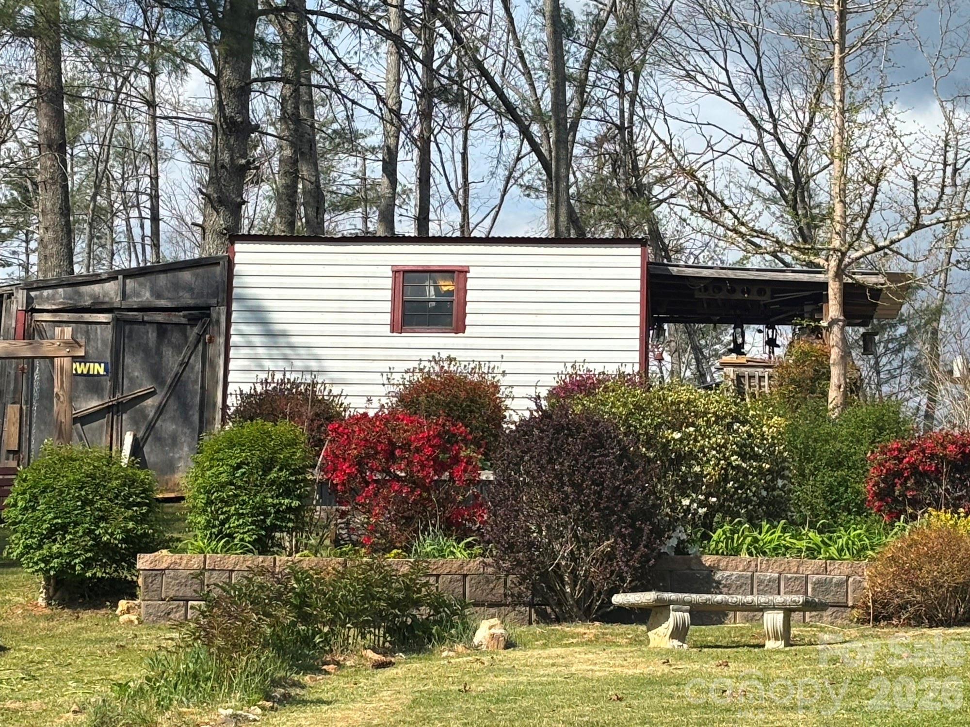 493 Franklintown Road Spruce Pine, NC 28777 - Photo 20 of 27 a view of a house with a yard