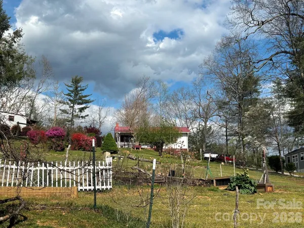 a view of houses with yard