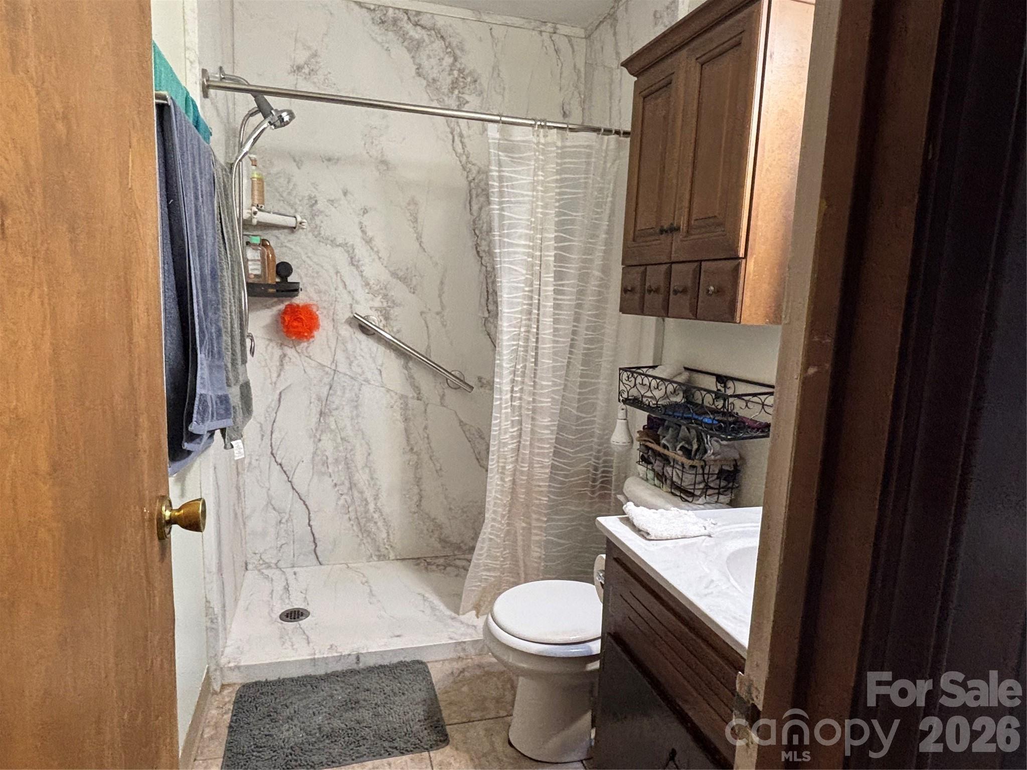 493 Franklintown Road Spruce Pine, NC 28777 - Photo 6 of 27 a bathroom with a sink toilet and shower