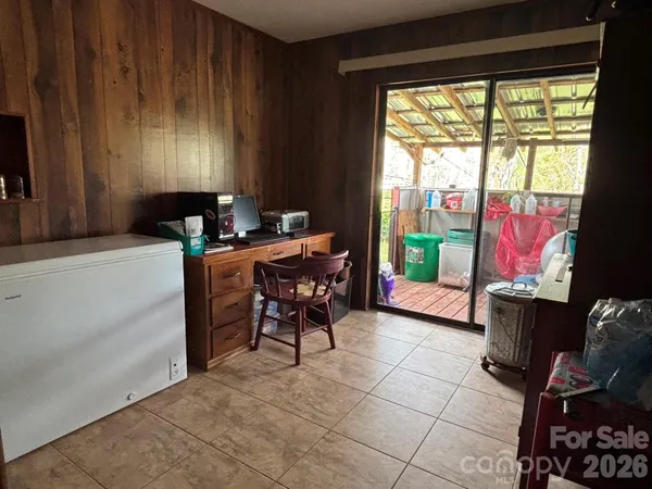 a workspace with furniture and a fireplace