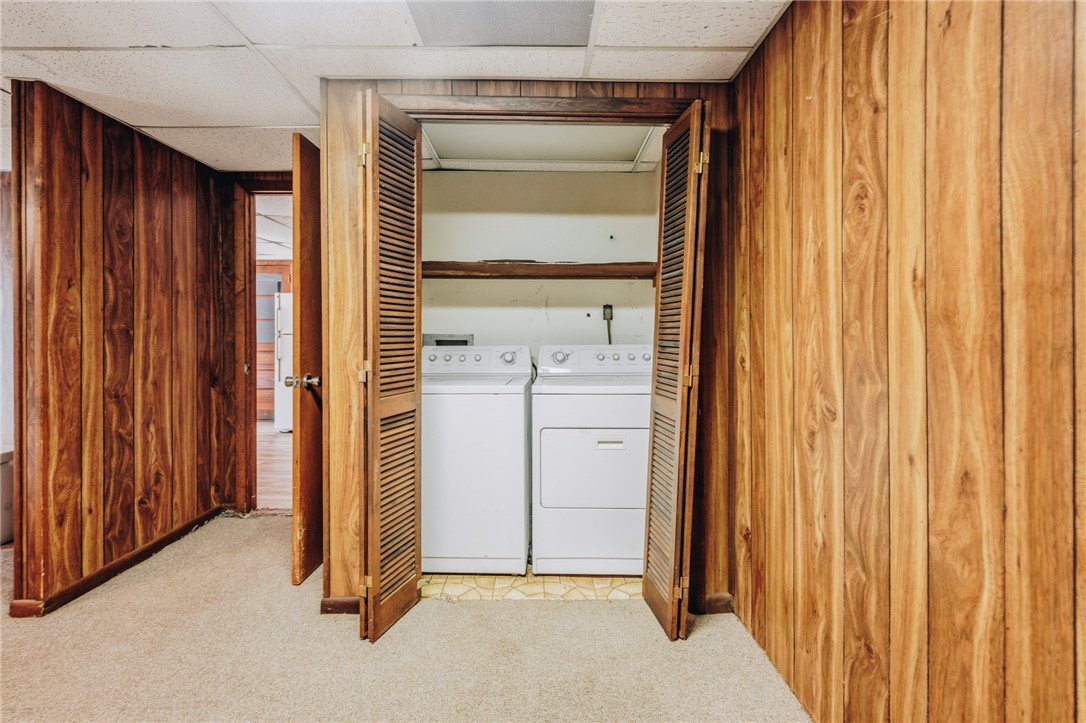 707 Campbell Town Road Walhalla, SC 29691 - Photo 33 of 44 Rich wood paneling surrounds a dedicated laundry closet complete with folding doors in the lower level.