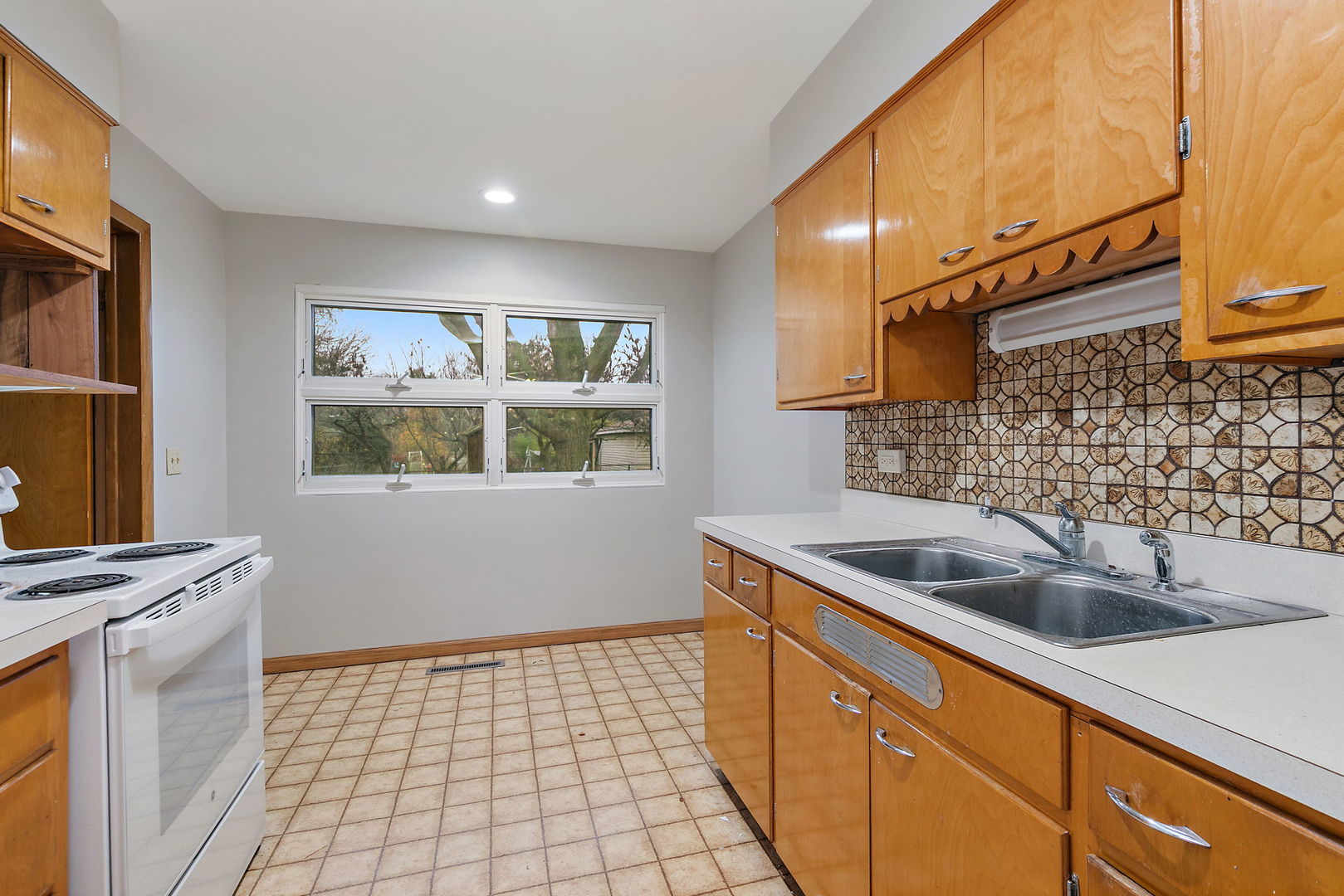 2 Adams Street East Dundee, IL 60118 - Photo 11 of 26 a kitchen with a sink and cabinets