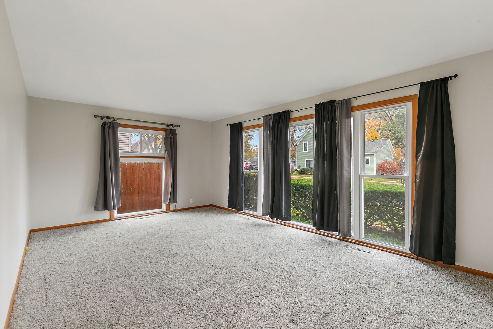 2 Adams Street East Dundee, IL 60118 - Photo 4 of 26 a view of an empty room with glass door and balcony