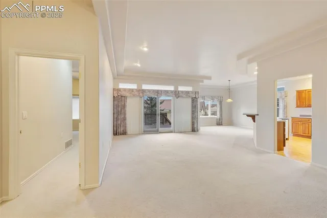 a view of a hallway with a bathroom
