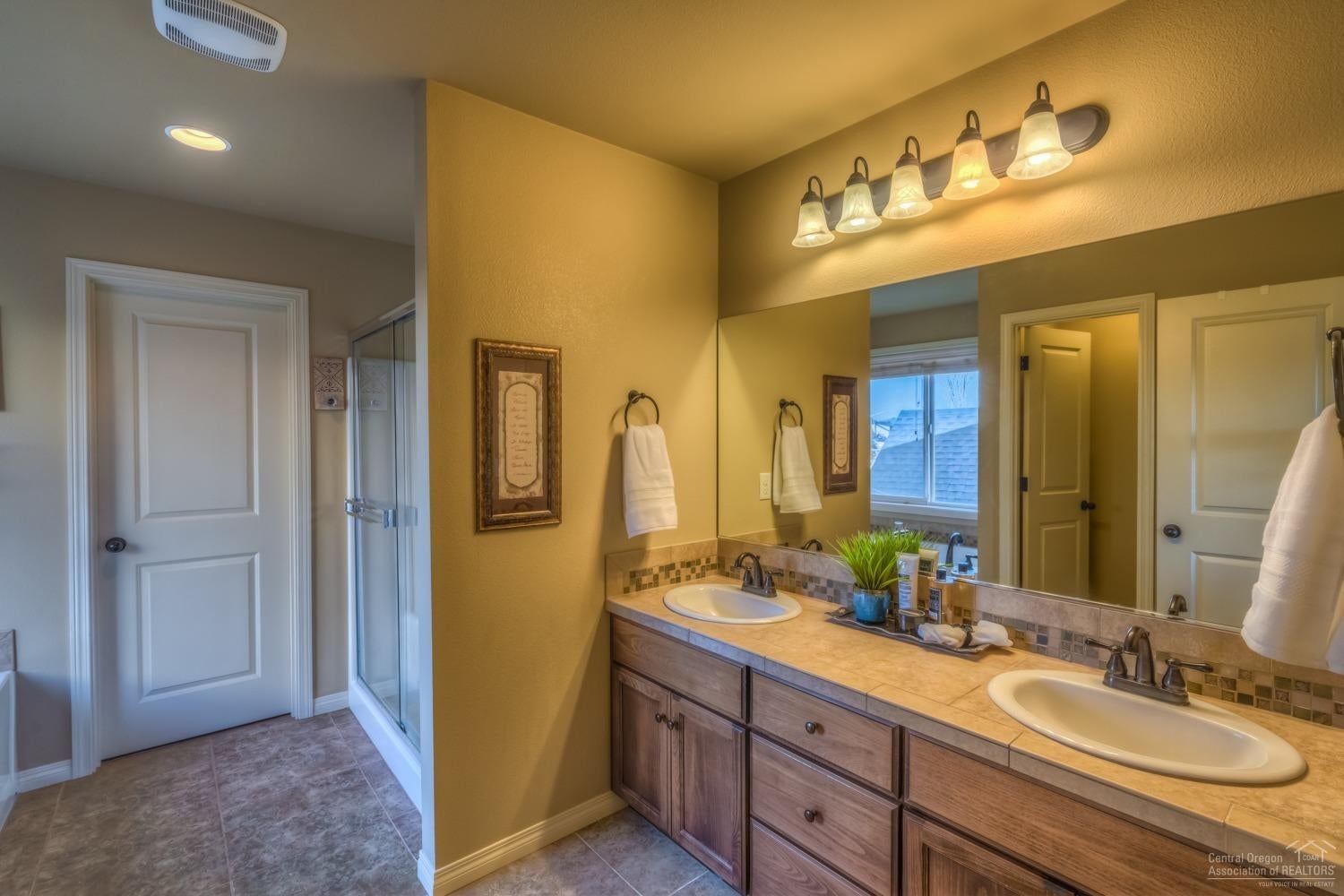 2905 Southwest 49th Street Redmond, OR 97756 - Photo 14 of 24 Master bath with dual vanities, soaking