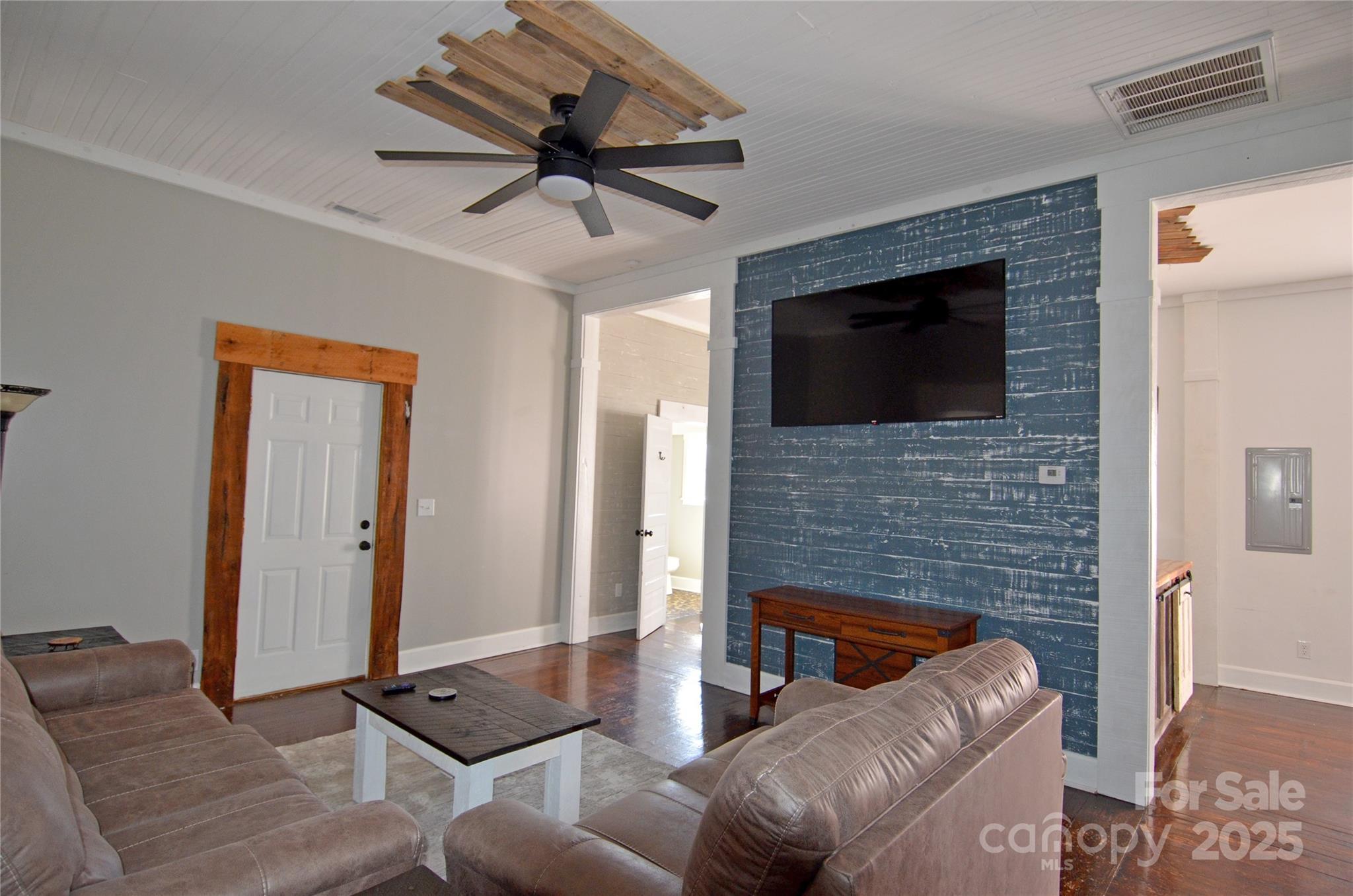 150 Hoyle Street, Unit 7 Marion, NC 28752 - Photo 14 of 21 a living room with furniture and a flat screen tv