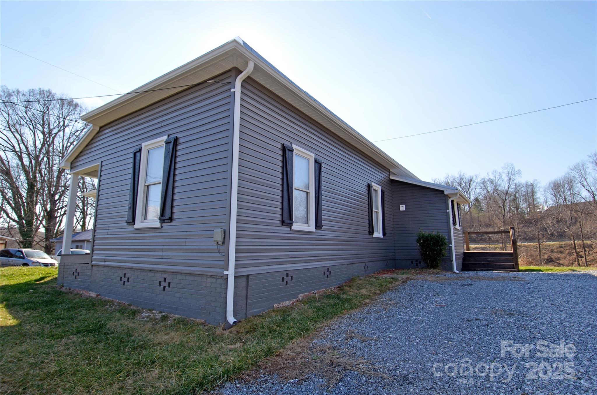 150 Hoyle Street, Unit 7 Marion, NC 28752 - Photo 2 of 21 a view of brick house with a yard