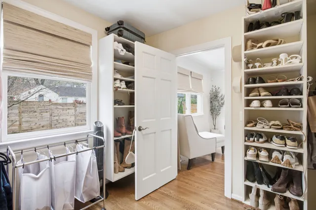 a large bathroom with a double vanity sink a large mirror and a shower